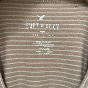 Pink shirt with white strips.